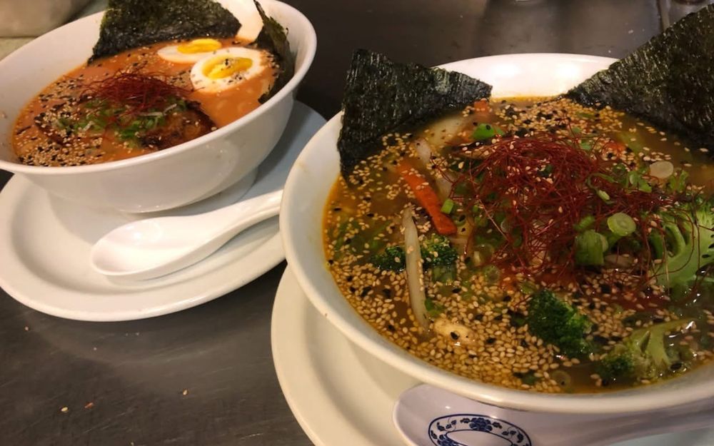 Two ramen bowls topped with nori, scallions, and sesame seeds at Mix Pacific Rim